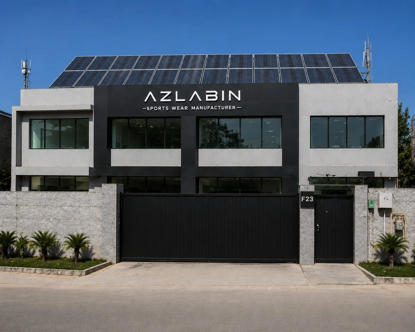 The AZLABIN sportswear manufacturing facility in Sialkot, Pakistan, with company signage above the entrance