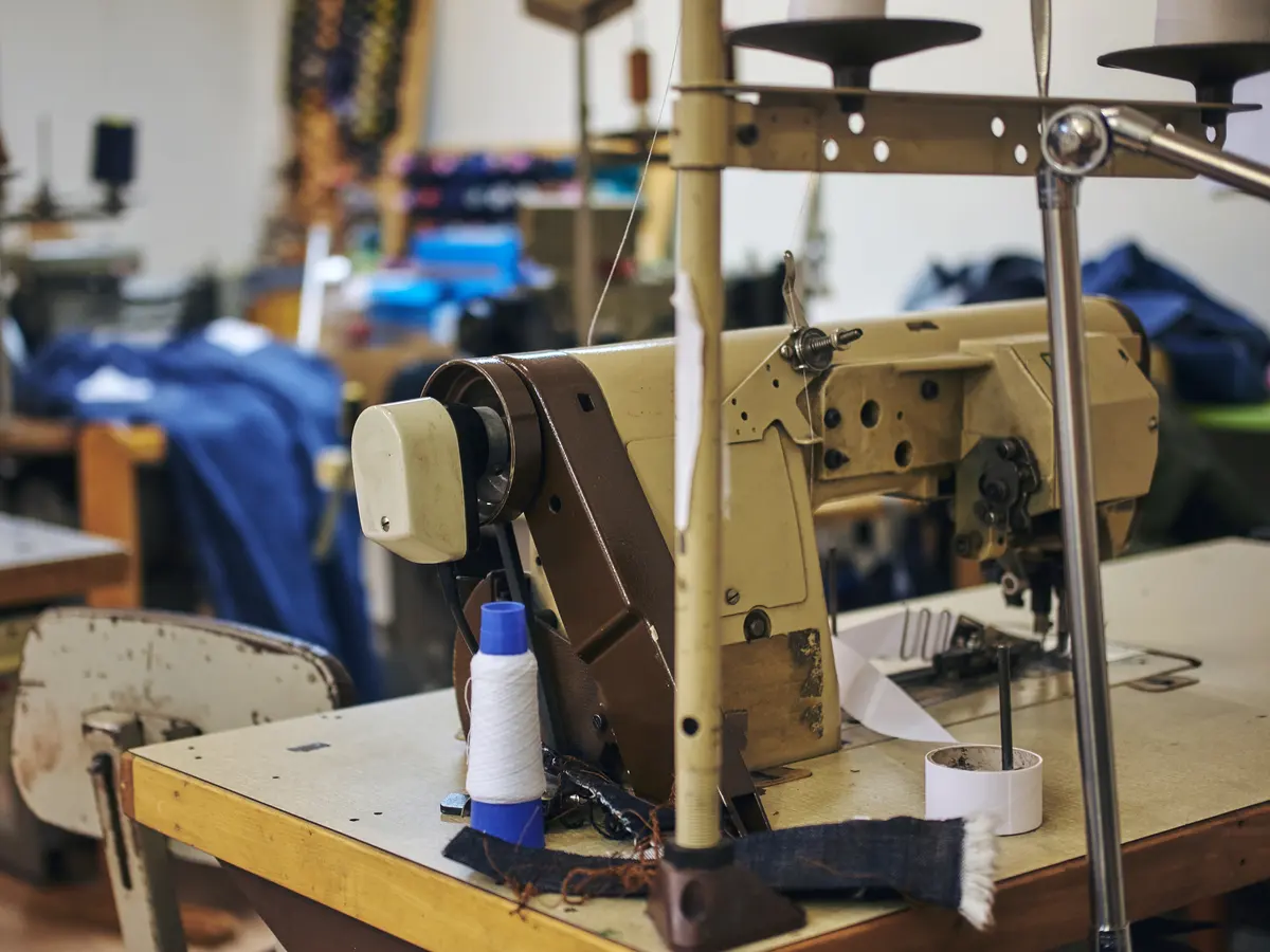 Industrial sewing machine at an AZLABIN stitching workstation
